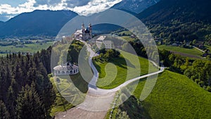 Wallfahrtskirche frauenberg is a beautiful church in the middle of Austria, drone panorama view of a church next to enn river in photo