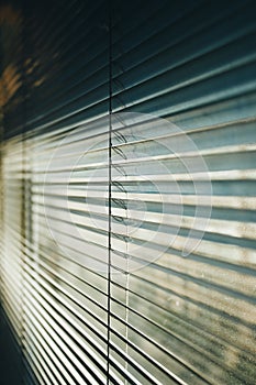 Wallpaper of a blind with cinematic tones during a sunny day