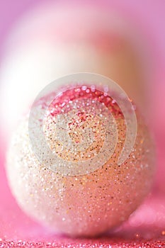 Wallpaper phone with pink glitter.background in lilac and white colors with round balls.Shiny Festive Background.soft