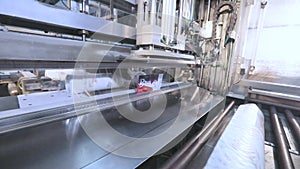 Wallpaper production process in a modern factory. Modern wallpaper production conveyor. Automated wallpaper production