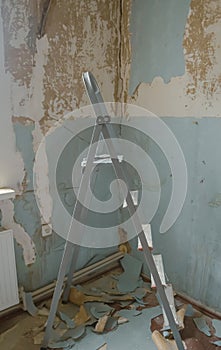 Wallpaper is removed from the wall - a staircase. Repair: the staircase stands next to the wall from which the wallpaper