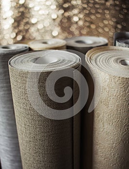 Wallpaper rolls displayed. Shiny background.