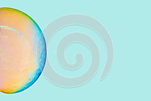 Wallpaper sphere with turquoise green and orange on colorful background