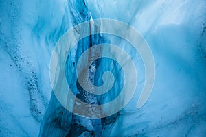 Walls of blue ice inside a deep crevasse on the Matanuska Glacier, Alaska