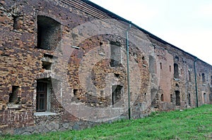 The walls of the building of the circular barracks of the memorial complex Brest fortress-hero, pierced by enemy shells