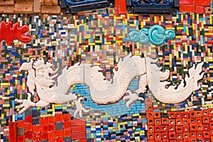 Walls covered with colorful ceramic tiles in Tao Hong Tai Ceramics Factory at Ratchaburi, Thailand.