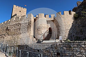 Walls and entrance door of the Almohad castle of Sax on top of a rock. Sax, Alicante, Spain photo