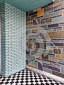 Walls and floor in different tiles .