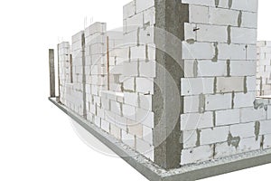 The walls of a house built of white brick with reinforced concrete pillars at the end of which there are ribbed rods, wooden formw