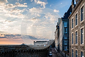 The walls and houses of Saint Malo at sunset