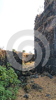 The Walls of an Indian Lohagad Fort With A View Of Mountain Range of Western Ghats of Sahyadri Of Maharashtra, India.