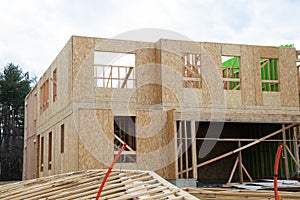 the walls of the new house are covered with plywood frame wood