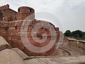 The walls of the Red Fortress standing solemnly in Agra, India