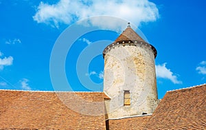 Walls roof old tower of Blandy-les-Tours castle over sky