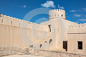 Walls, stairs and tower of Sunaysilah fort in town of Sur, Oman