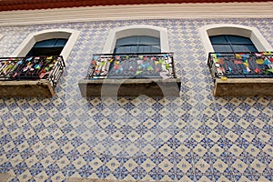 Walls of the streets of the historic center of Sao Luis, Maranhao, Brazil with decorative tiles and windows with balconies.