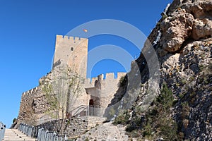 Walls and tower of the Almohad castle of Sax on top of a rock. Sax, Alicante, Spain photo