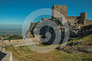 Walls and towers over rocky hill with garden at the Marvao Castle