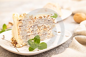 Walnut and almond cake on brown concrete, side view, selective focus