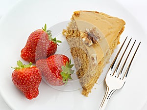 Walnut cake with strawberries and fork