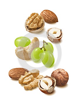 Walnut, cashew, almond, hazelnut nuts and green grapes isolated on white background
