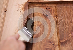 Walnut Colored Stain Being Painted on a Pine Wood Door