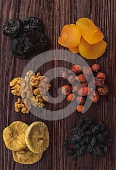 Walnut, figs, dried apricots, prunes, raisins and wild rose on a