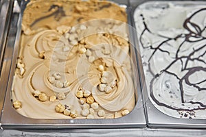 Walnut and hazelnut Gelato. Flavors various ice cream in Rome, Italy. Italian gelateria. Assortment of colorful gelato