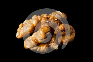 Walnut kernel, nut isolated on black background