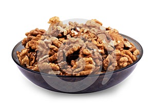 Walnut kernels on plate on a white background