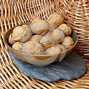 Walnut in messing bowl WalnÃÂ¼sse in Messing Schale noix dans un bol en laiton photo