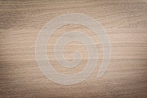 Walnut or oak wood grain background.