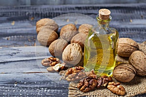 Walnut oil in bottle and nuts