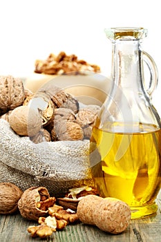 Walnut oil and nuts in a bag.