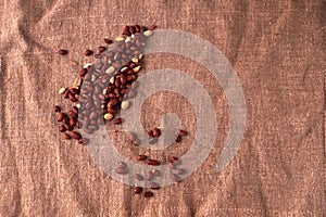 walnut peanut scattered on sackcloth background. Top view. Textured