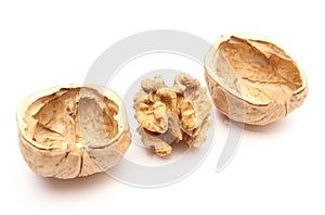 Walnut without shell and nutshells on white background