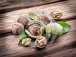 Walnut and walnut kernel on a wooden table.