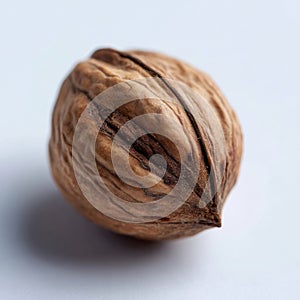 A walnut on a white surface with a white background