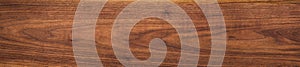 Walnut wood texture.  Natural texture background of North American walnut wood board.  Long wood plank texture.