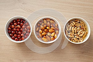 Walnuts, almonds and hazelnuts soaking in water