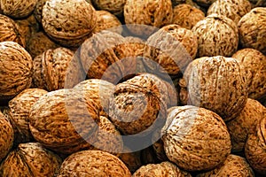Pile of Walnuts in the basket close up view texture background
