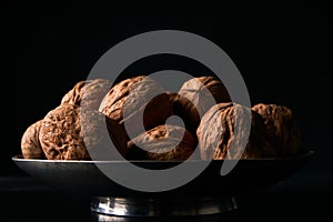 Walnuts on black background