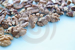 Walnuts on blue background. Benefits of nuts in daily human die