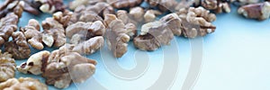 Walnuts on blue background. Benefits of nuts in daily human die