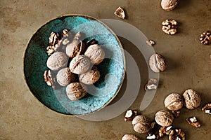 Walnuts in a bowl on a table