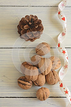 Walnuts, cone and ribbon.