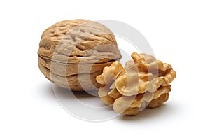 Walnuts and cracked walnut isolated on white