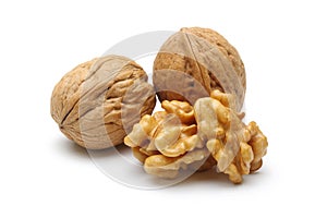 Walnuts and cracked walnut isolated on white