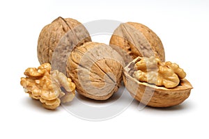 Walnuts and cracked walnut isolated on white