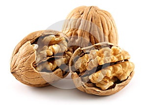 Walnuts and cracked walnut isolated on white